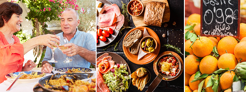 Spansk tapas, paella med skaldjur och apelsiner på en långtidssemester i Andalusien.